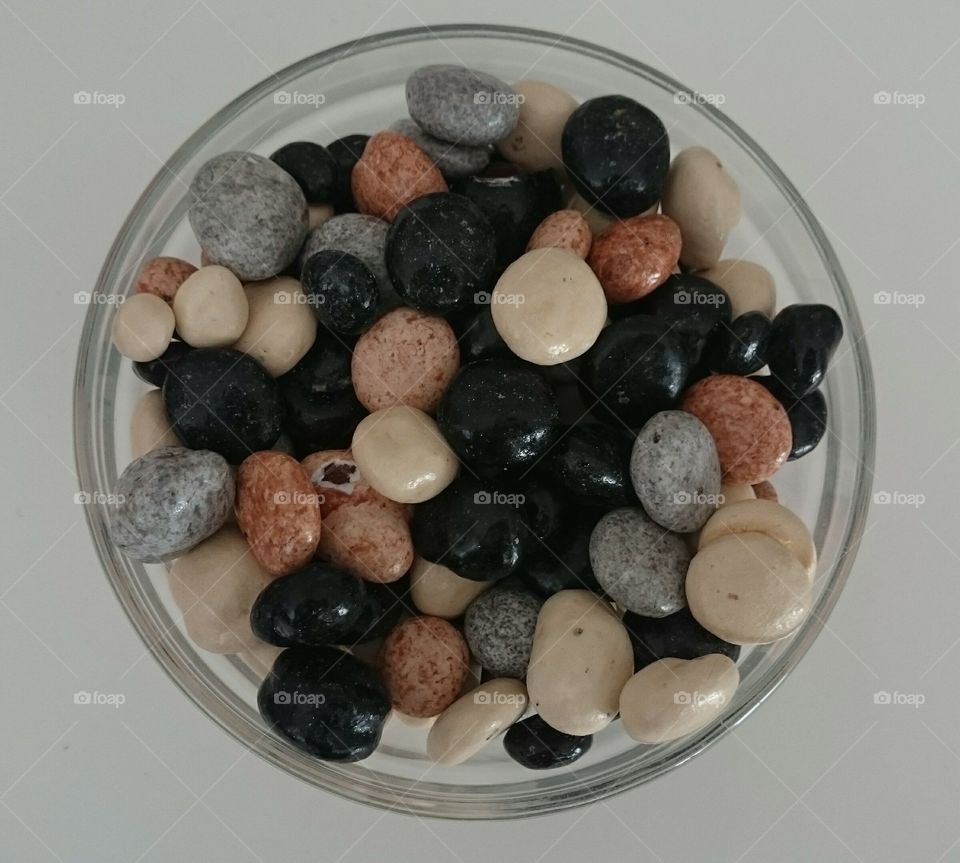 bowl filled with candy stones. a bowl of candy stones