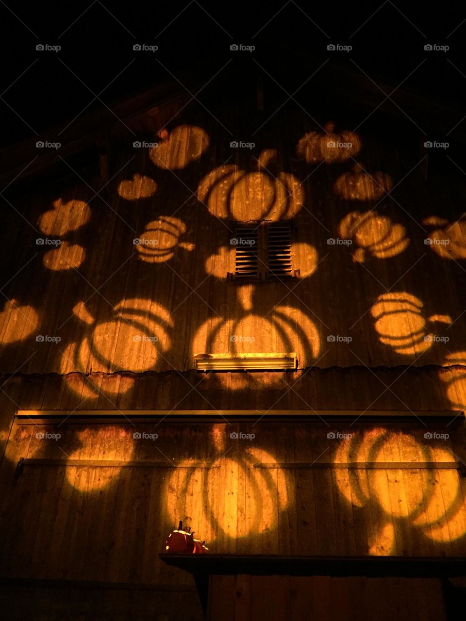 Many Orange pumpkins on the wall 