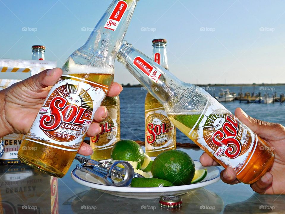 Liquids are cool - Cheers - Life is good on the deck overlooking the boats traveling the waterway with ice cold beers