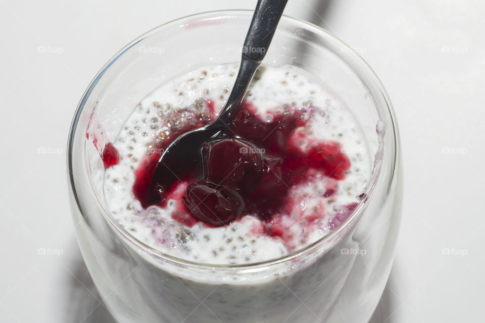 Delicious dessert of yogurt, chia seeds and cherry jam