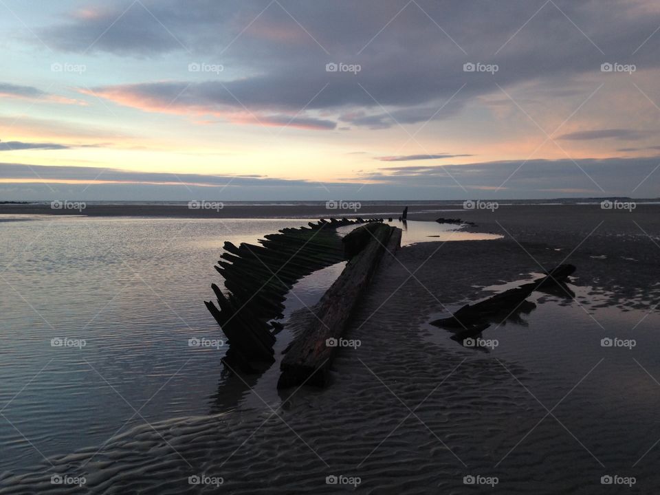 Sunrise over a shipwreck
