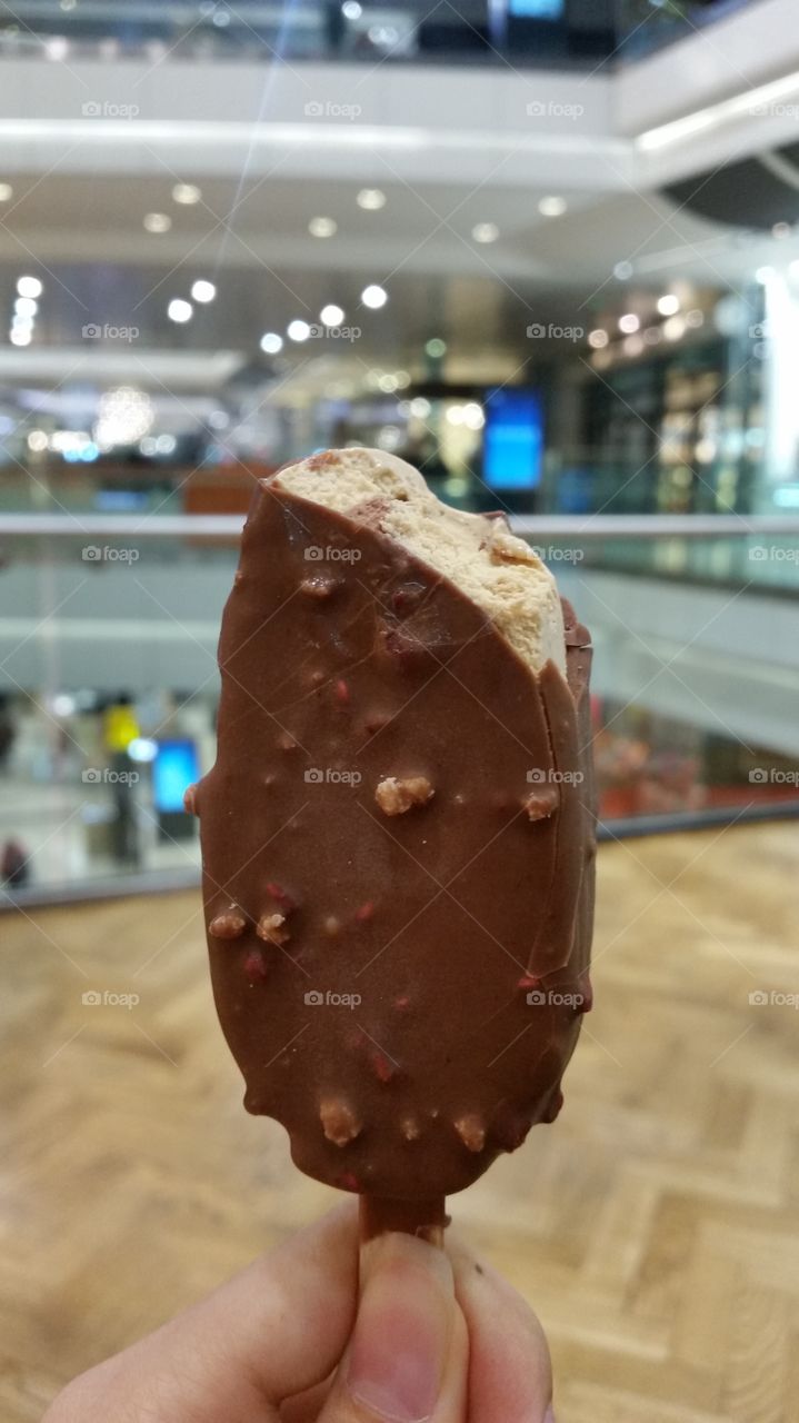 Eating icecream in a shopping center