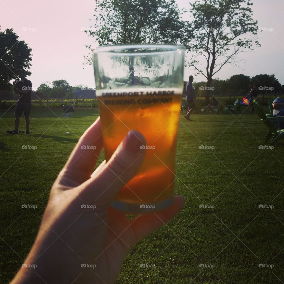 Greenport Harbor craft beer out on a field