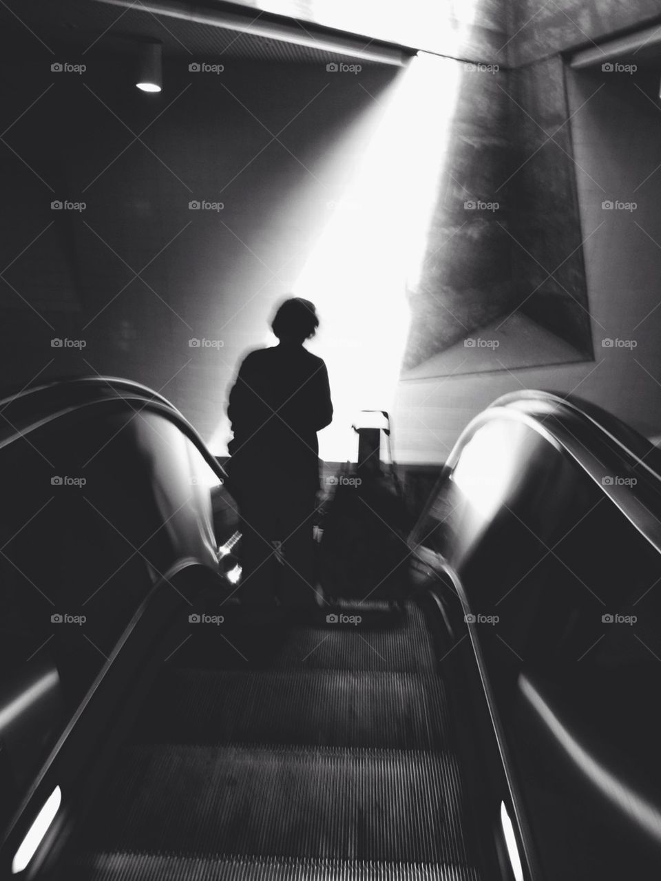 Silhouette on Escalator