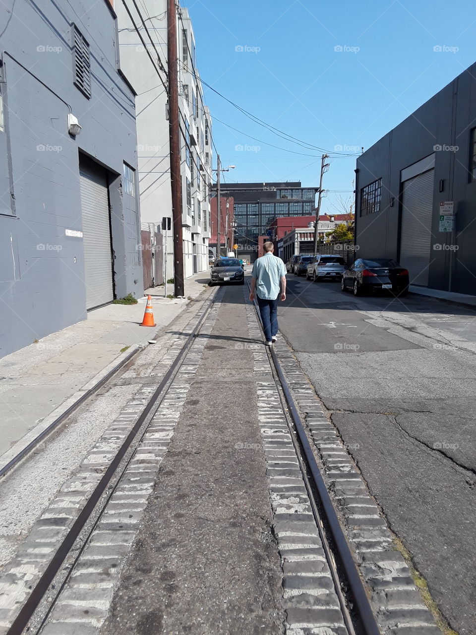 A stroll on a street  train tracks San Francisco California