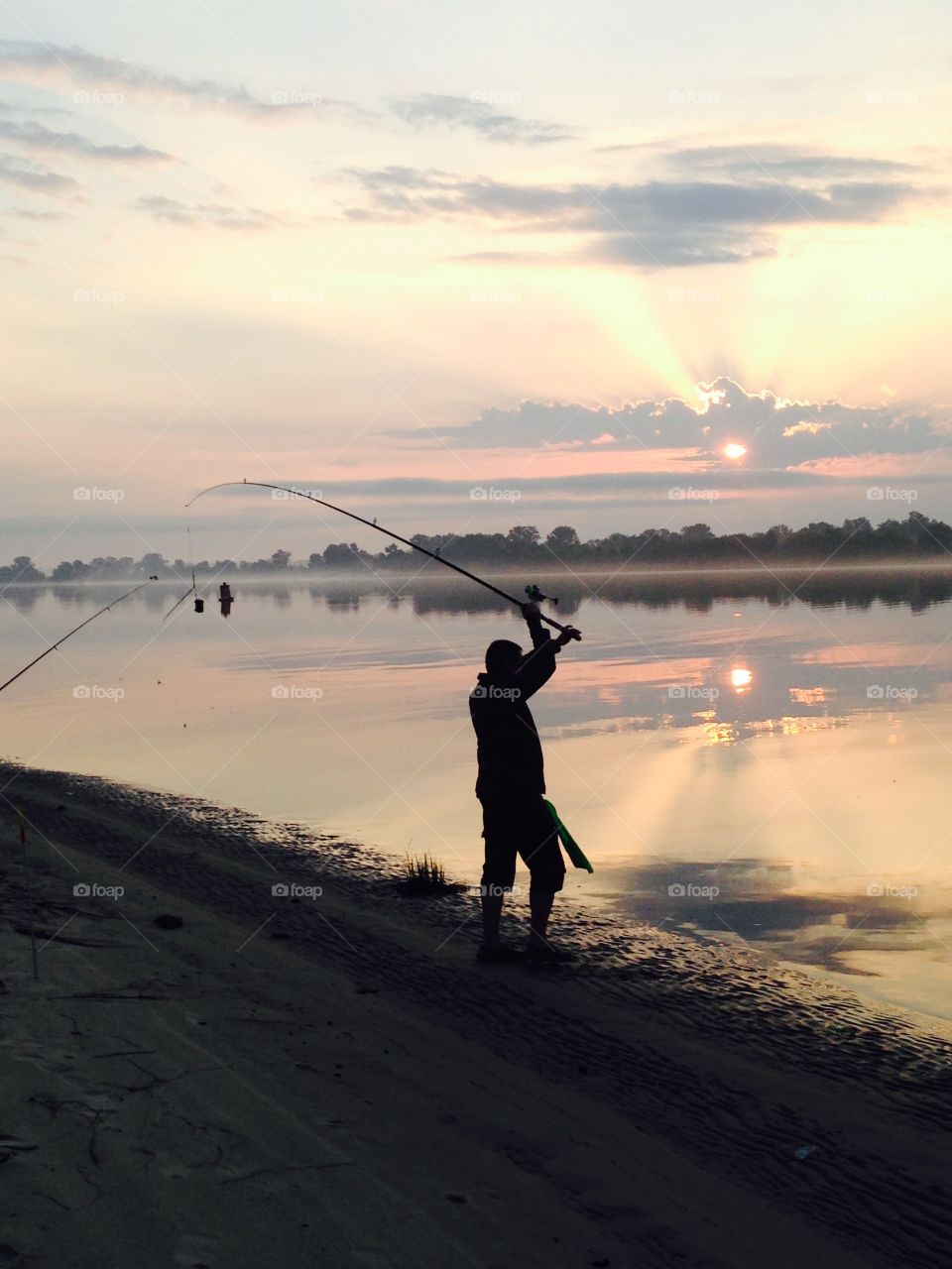 fishing in the river at dawn