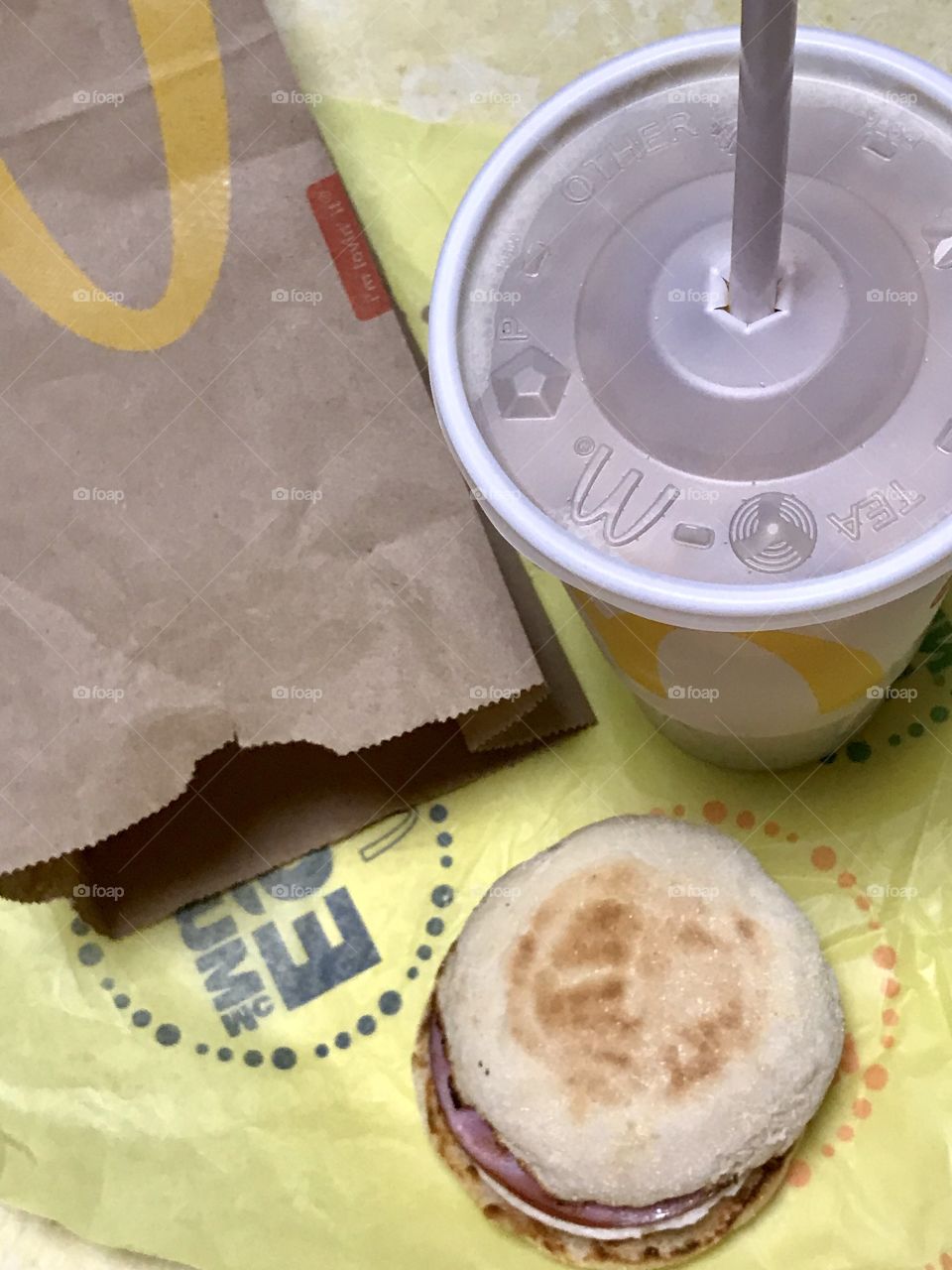 McDonald’s Egg McMuffin and a drink flat lay