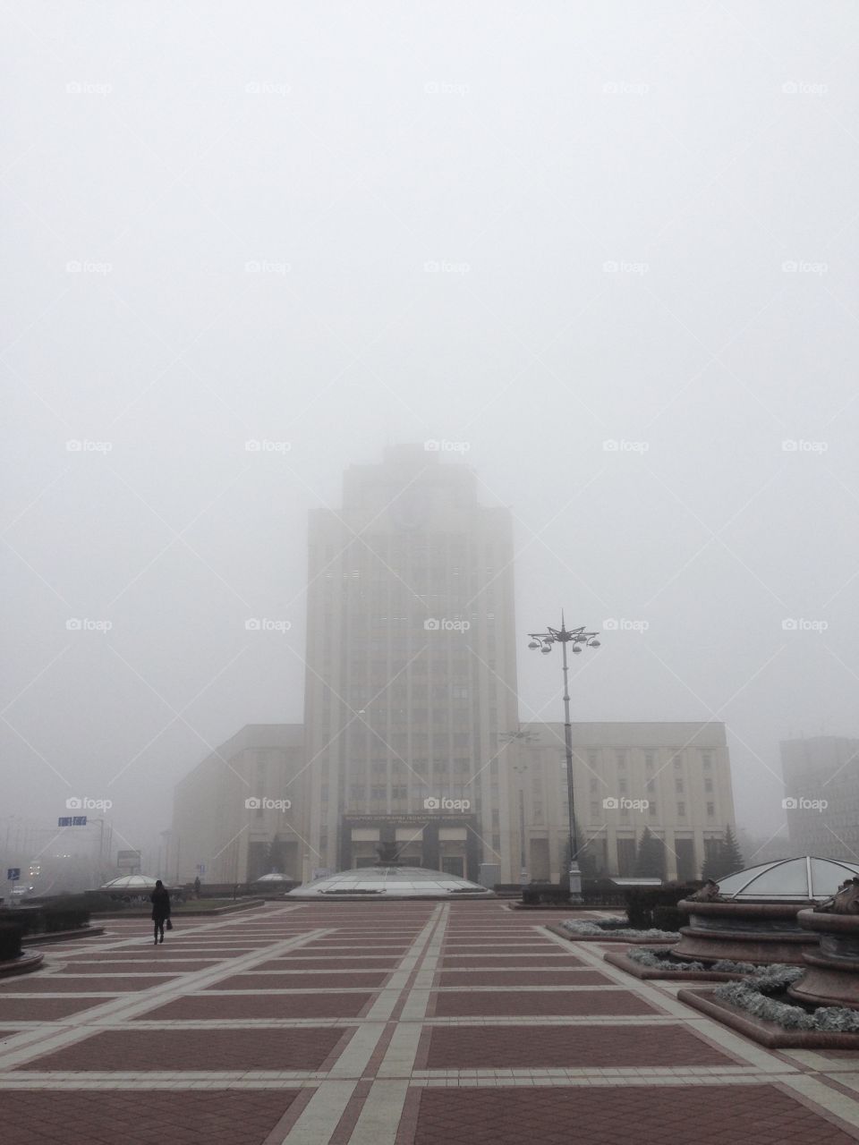 Grey foggy morning on independence square in Minsk capital of Belarus 