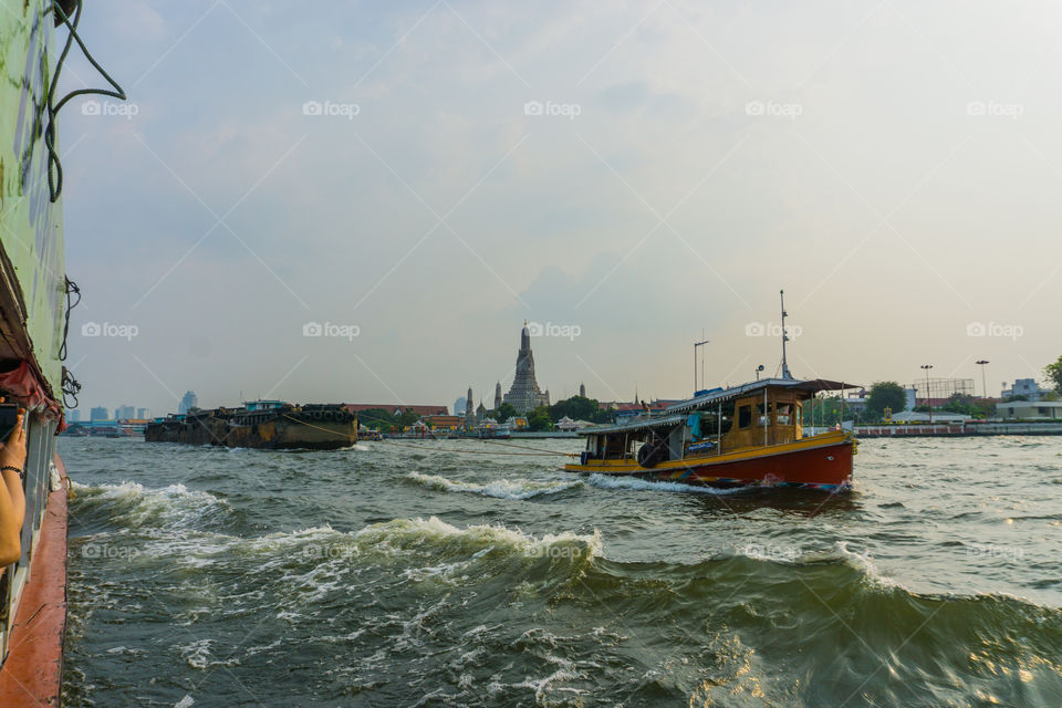 Vat Arun from boat on Chao Phraya river, Bangkok, Thiland