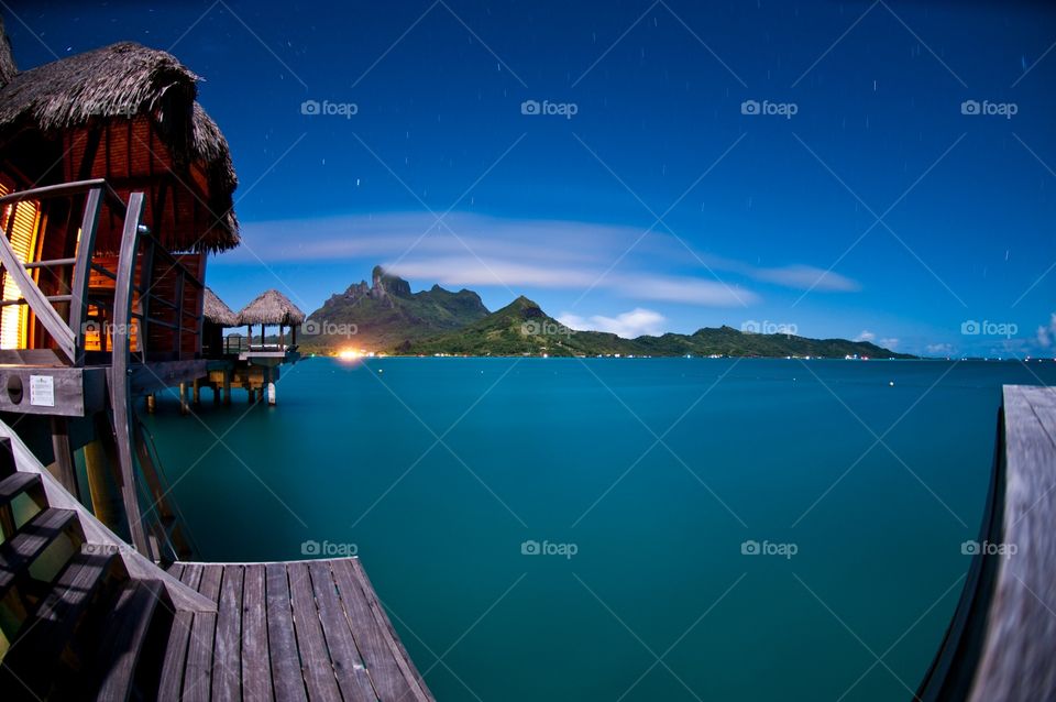 Night fisheye lens off the private suite dock in bora bora at the Fourseasons 