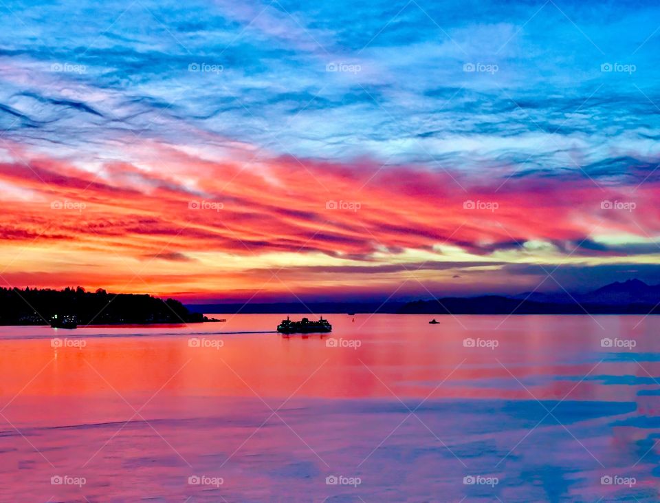 Bright red sunset with ships on the Pacific Ocean 