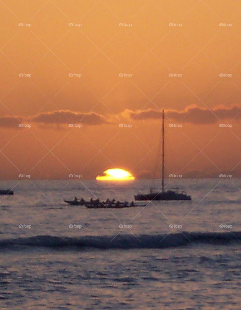 boats. sailing and rowing on a warm hawaii evening