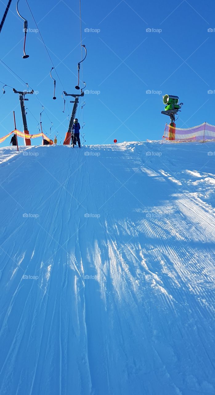 ski tracks in the ski lift and beautiful blue sky