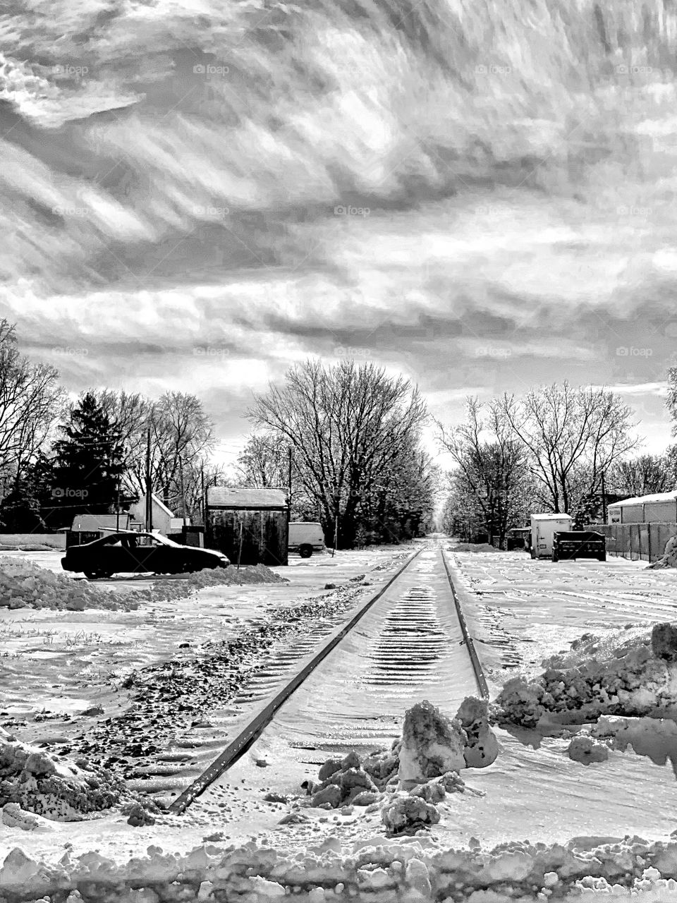 Black and white and old train tracks in Indiana on a snowy winter day 