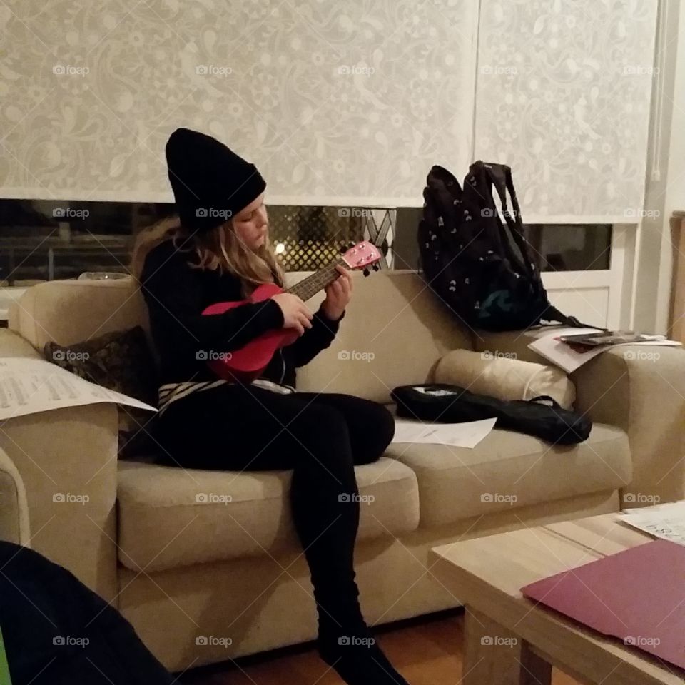 Playing the ukulele