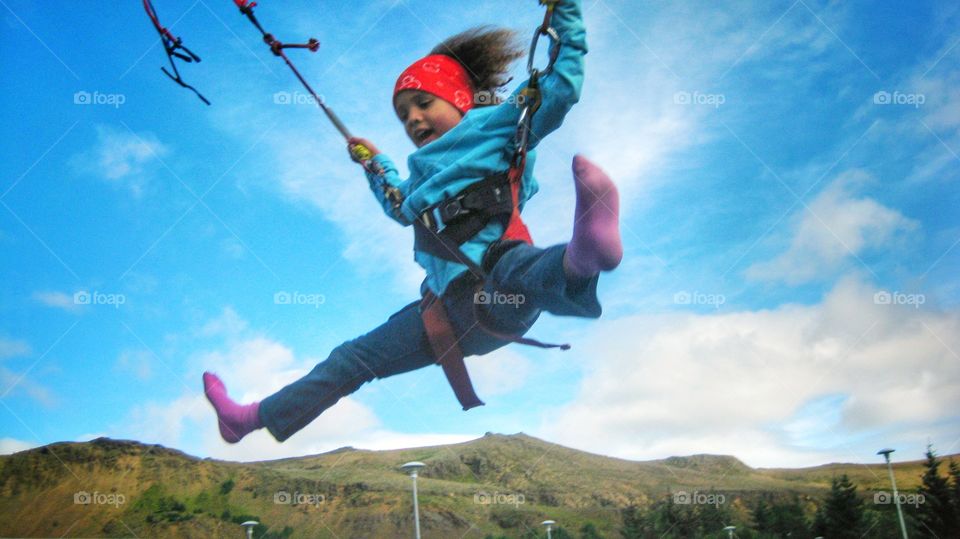 Having fun at a local Carnival in a jumping bungee.   Summertime taking the kids around to create memories so good.