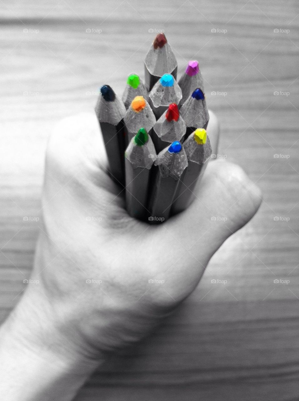 Color pencils in someone hand
