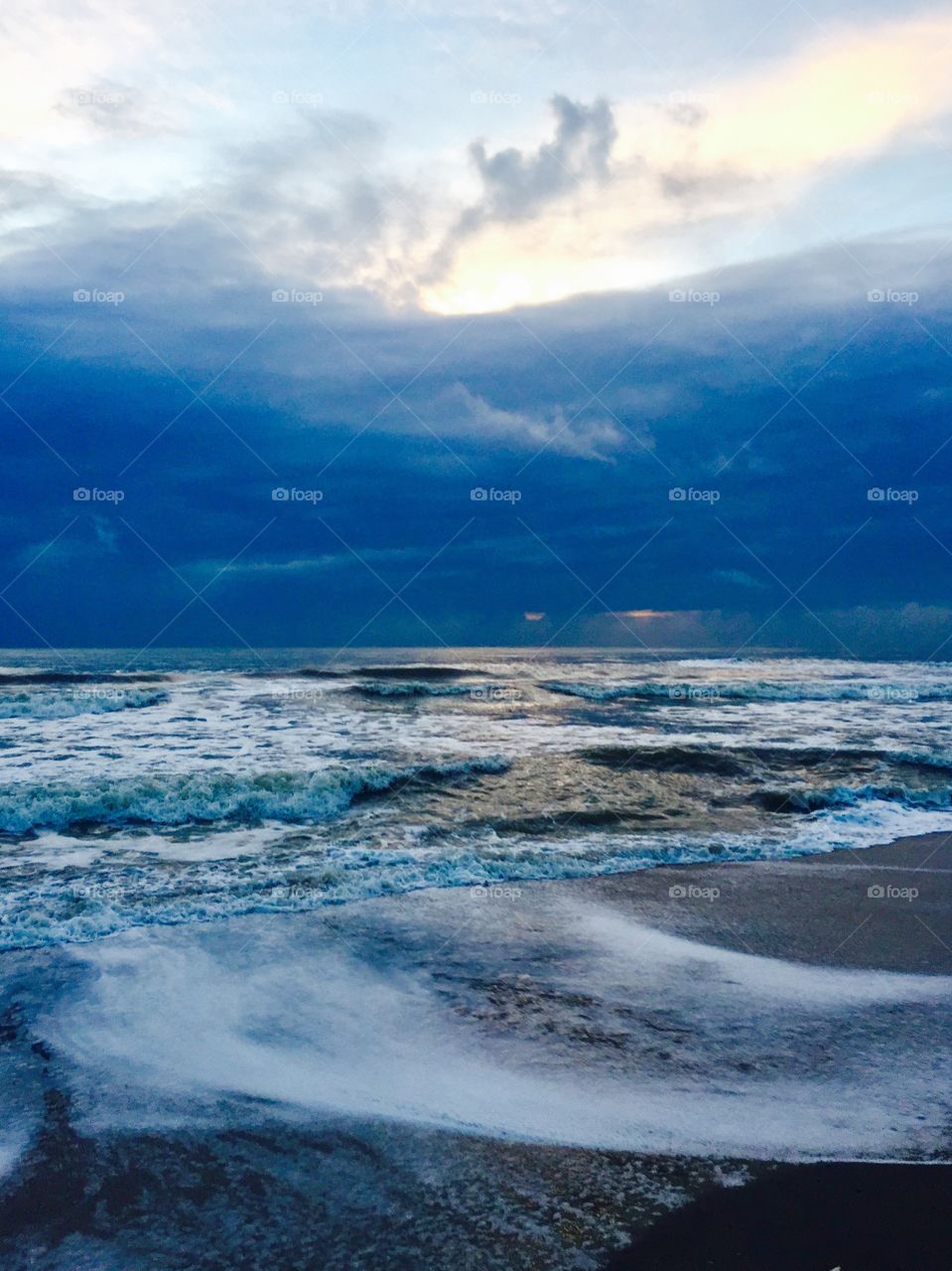 Stormy. Clouds. Sea. Deep blue. Waves.  Tempest.  