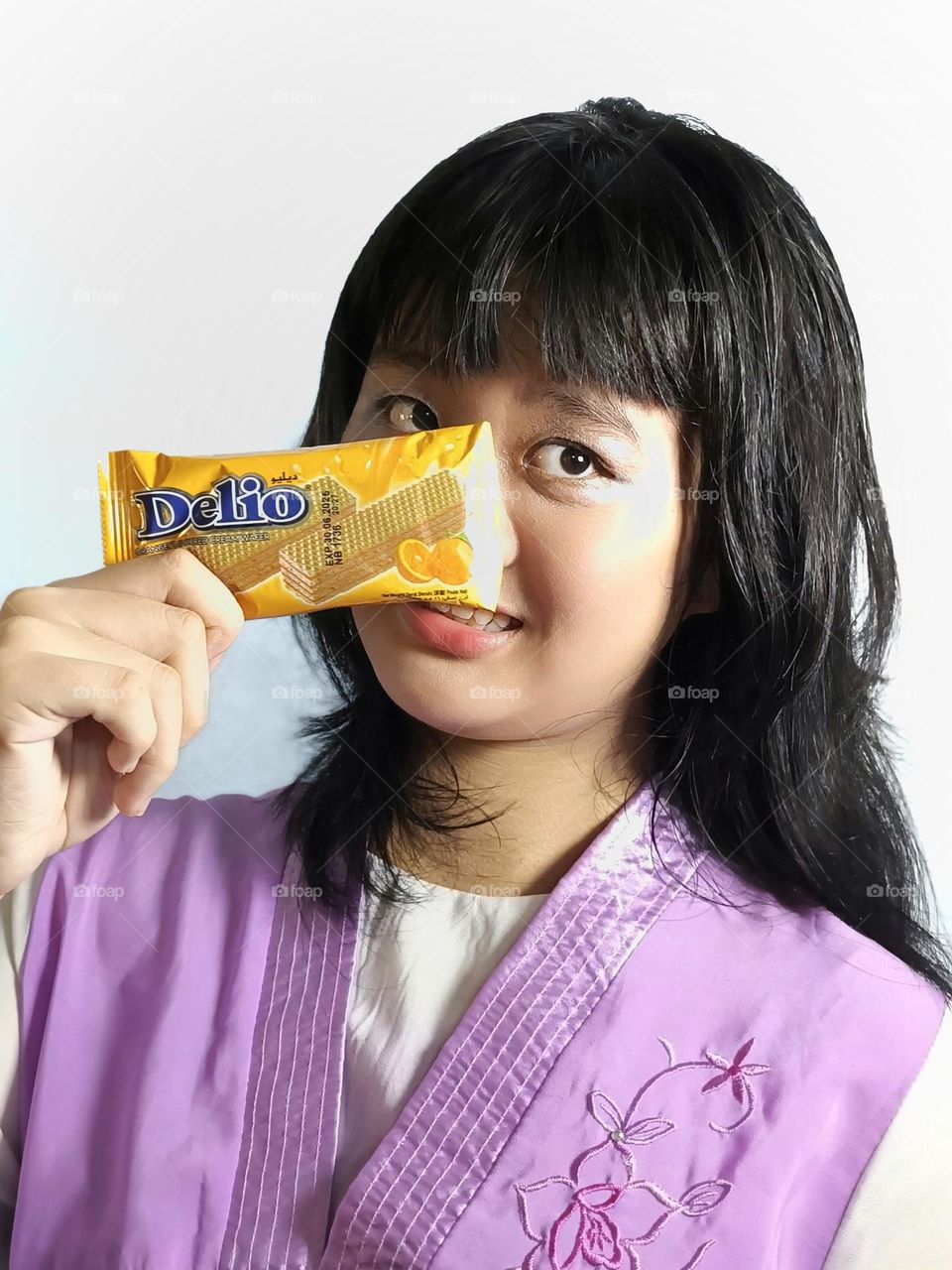 A Chinese girl with a candy bar.