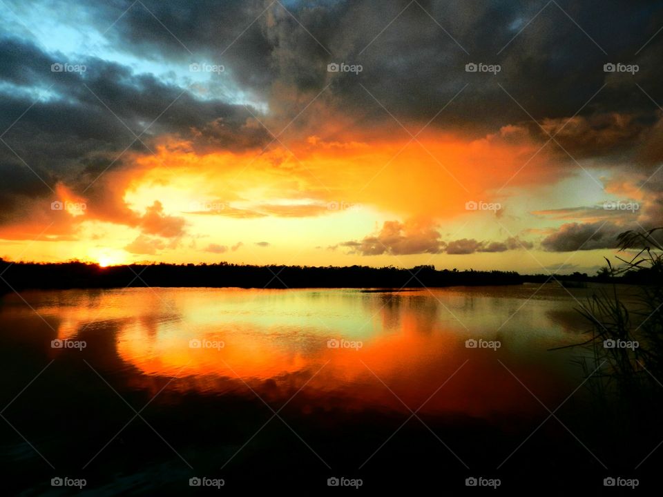 Clouds reflecting on the lake at sunset
