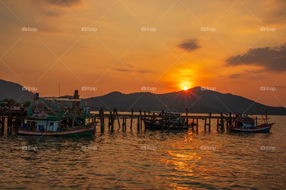Thai Fisherman's Boats at a Fishing Pier in Bangsaray District Chonburi Thailand Southeast Asia during the Sunset Timeline