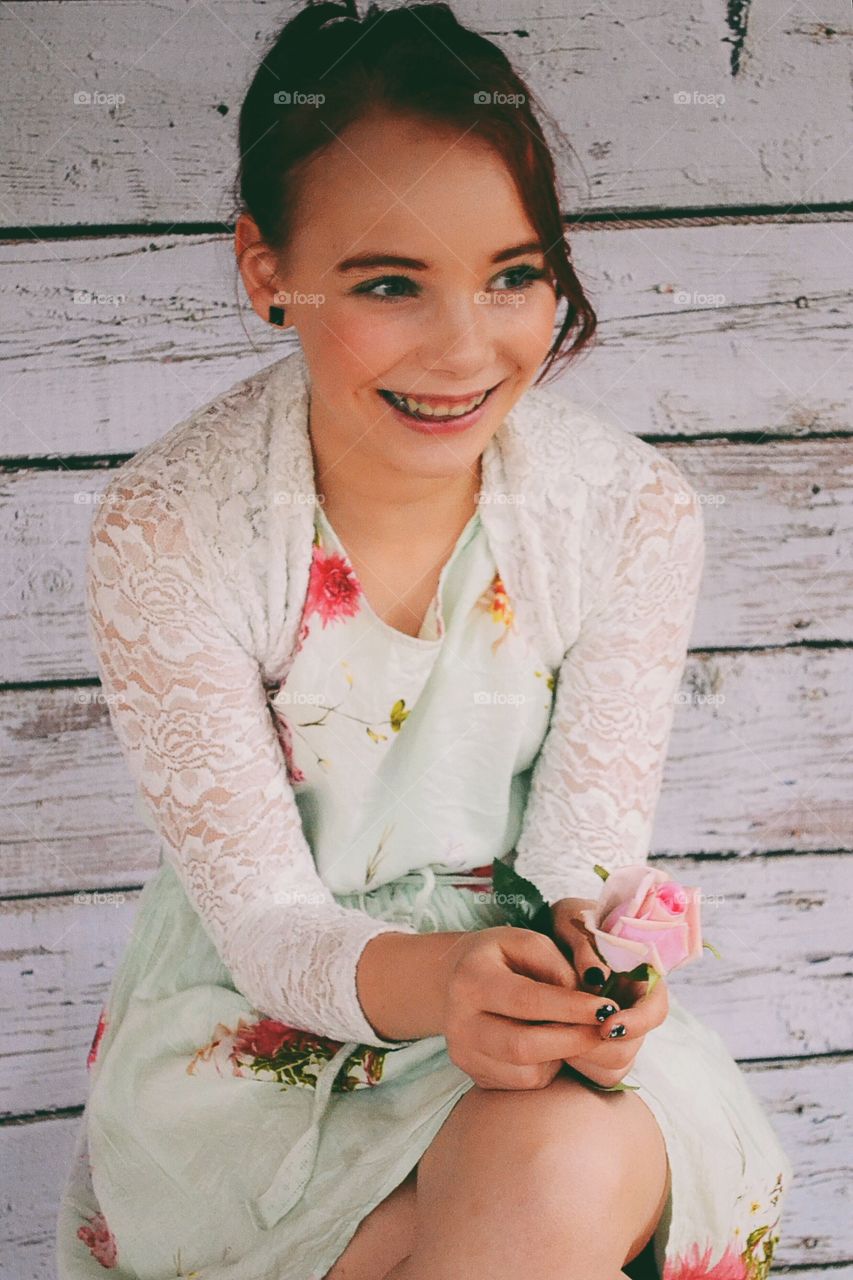 Happy smiling girl in flower dress