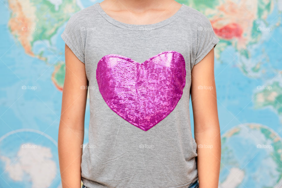 Pink heart shape on woman's t-shirt