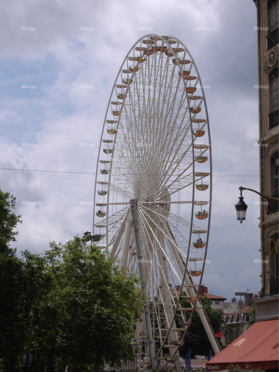 Giant Ferris Wheel in plaza. Lyon, France. 