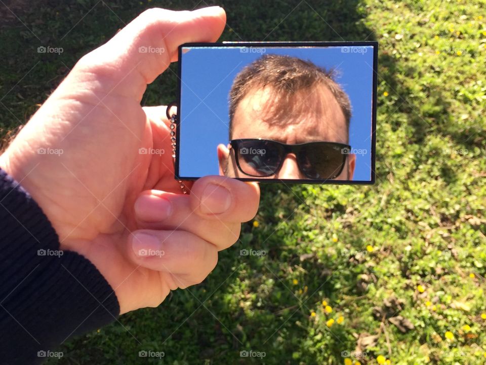 Young man looking in mirror