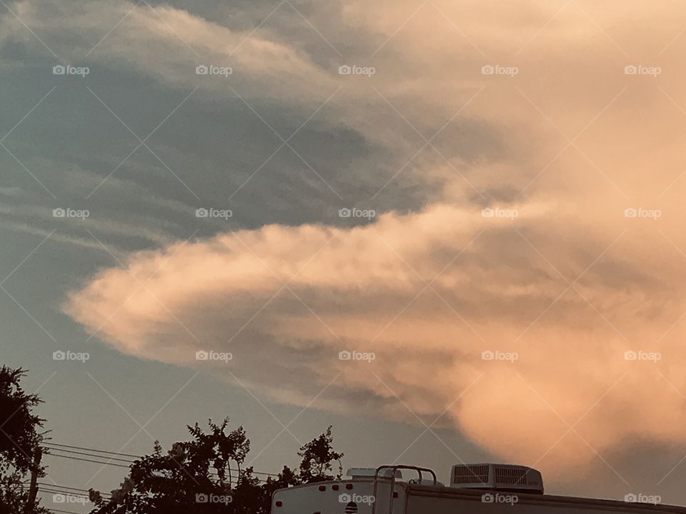 Scanning the sky after a light Rain. Looking to the North East and what appears to be some sort of Weather front. Very unusual appearance. 15 minutes later it had disappeared. Felt proud to Capture this Cloud Form.