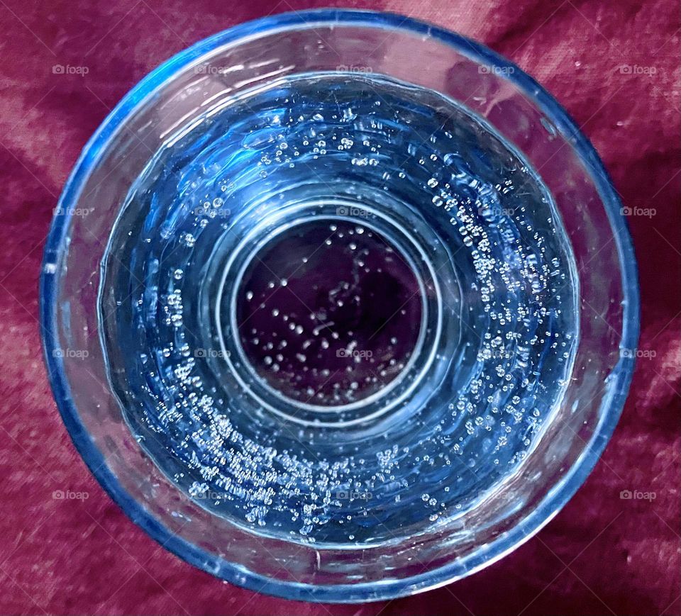 Mineral water in blue glass