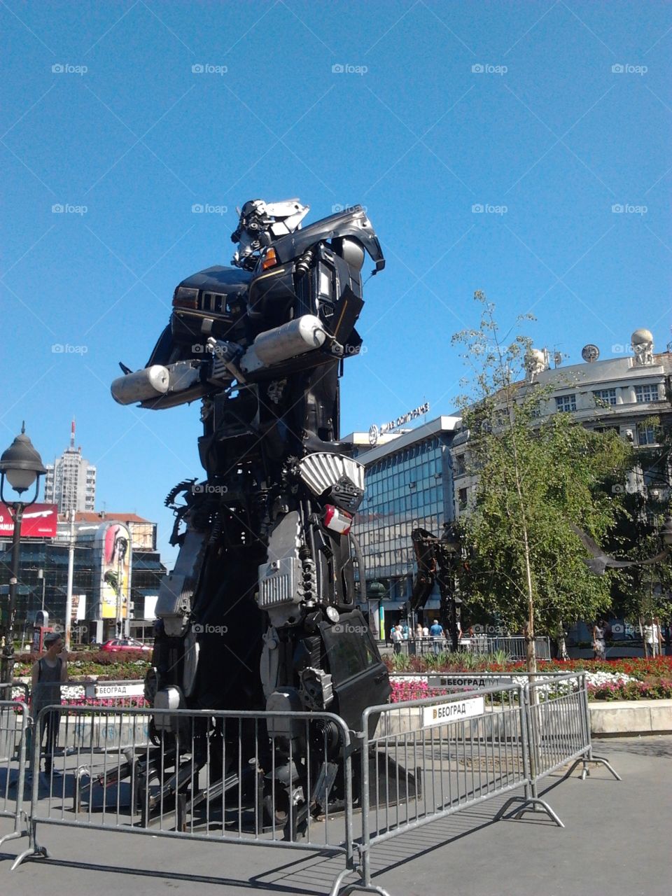 A giant transformer made out of recycled materials