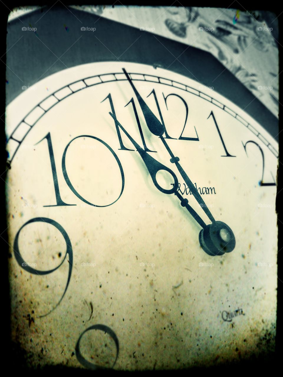 Vintage style picture of old clock striking 12 o'clock