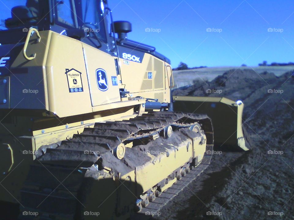 Operating my John Deere dozed on the pipeline. 