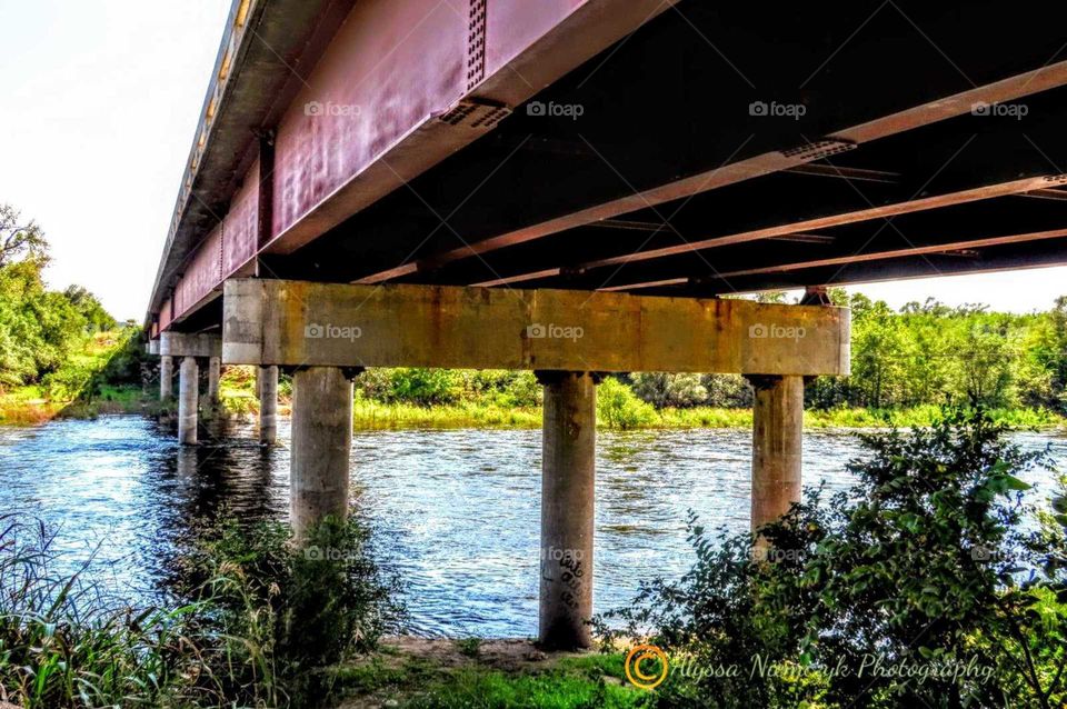 Ripping waters underneath bridge "Fish Like it Here". Fall has arrived! Spillway full from flooding.