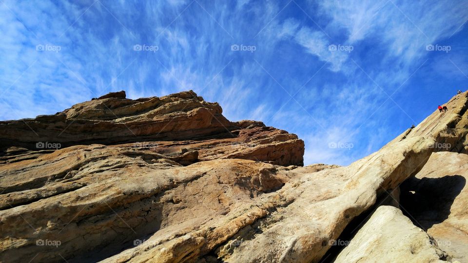 Two people climbing on the rocky mountain