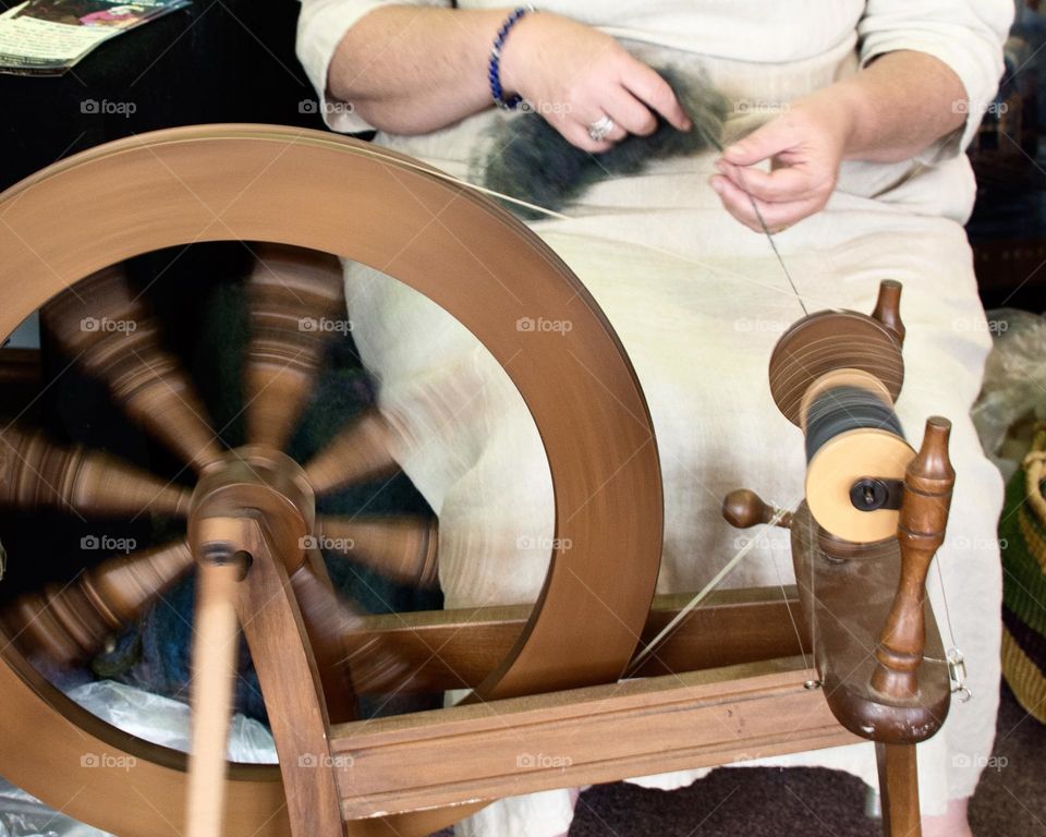 Woman using a spinning wheel 