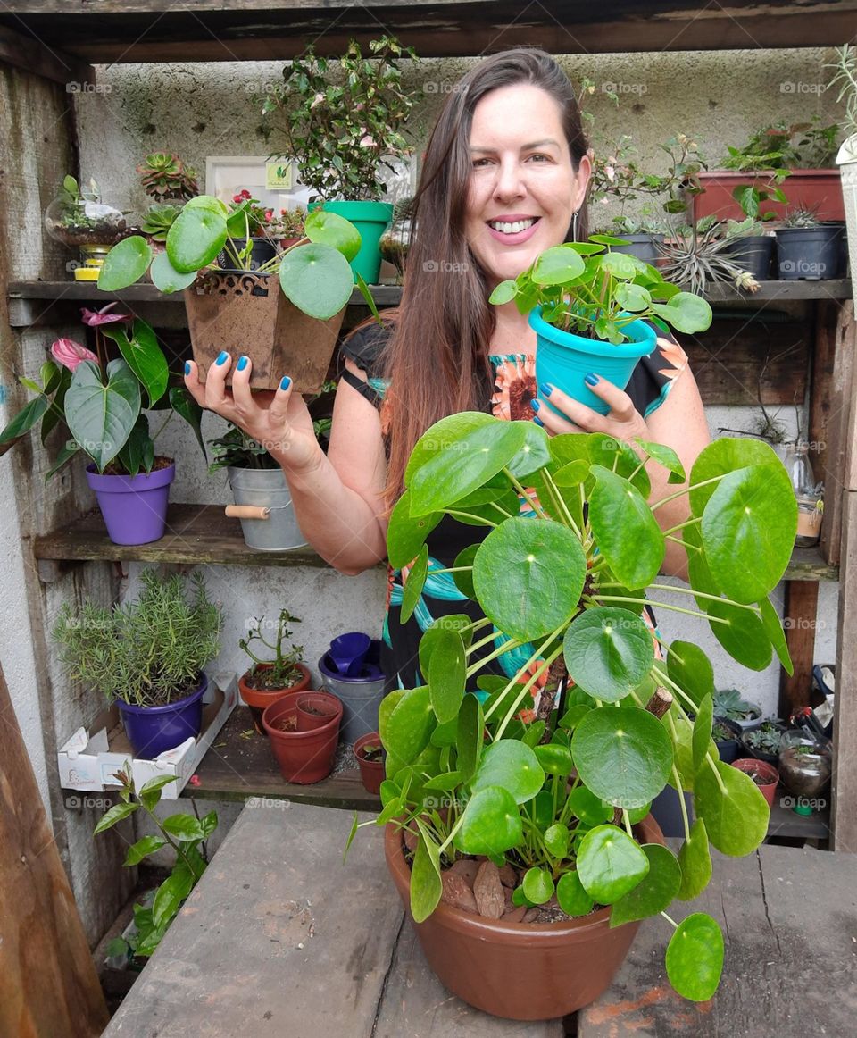 woman with lots of plants