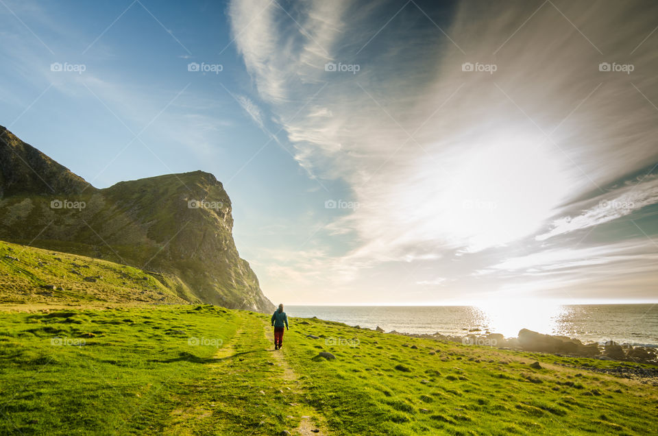 my wife walks on an old path in Lofoten