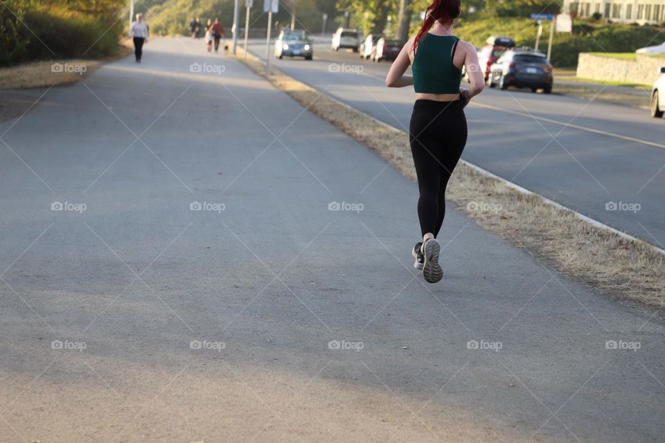 woman running on a path 