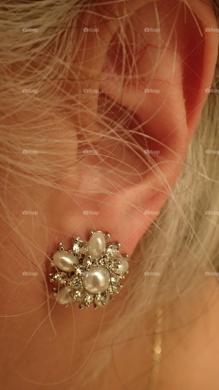 Heirloom silver and pearls earring on woman’s ear