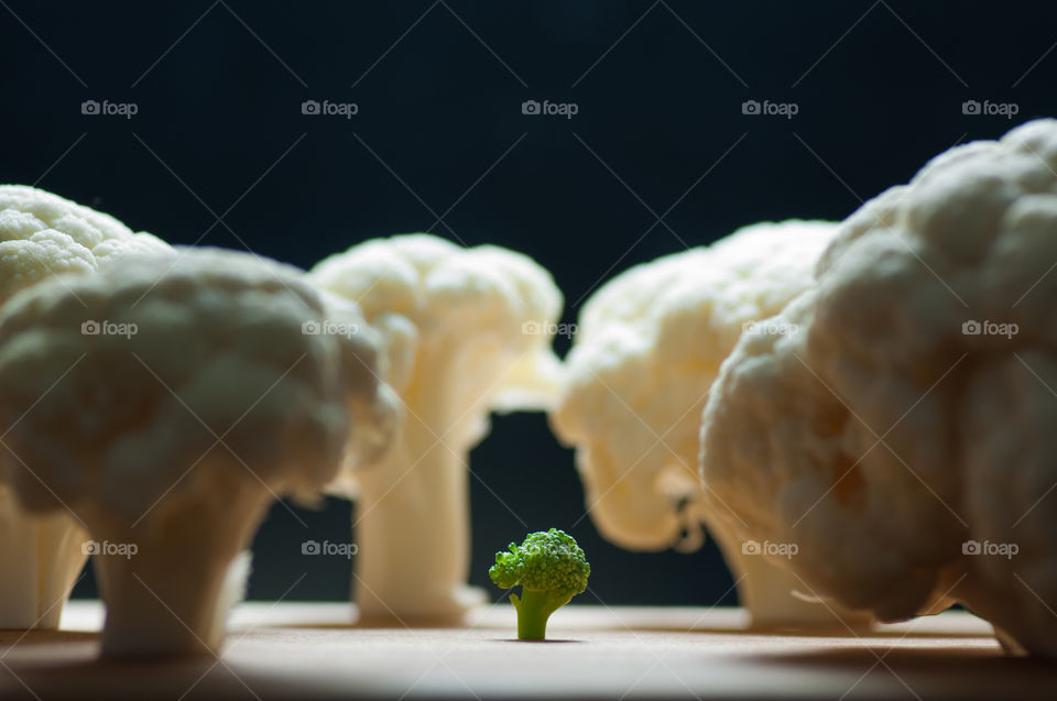 Small broccoli among big cauliflowers