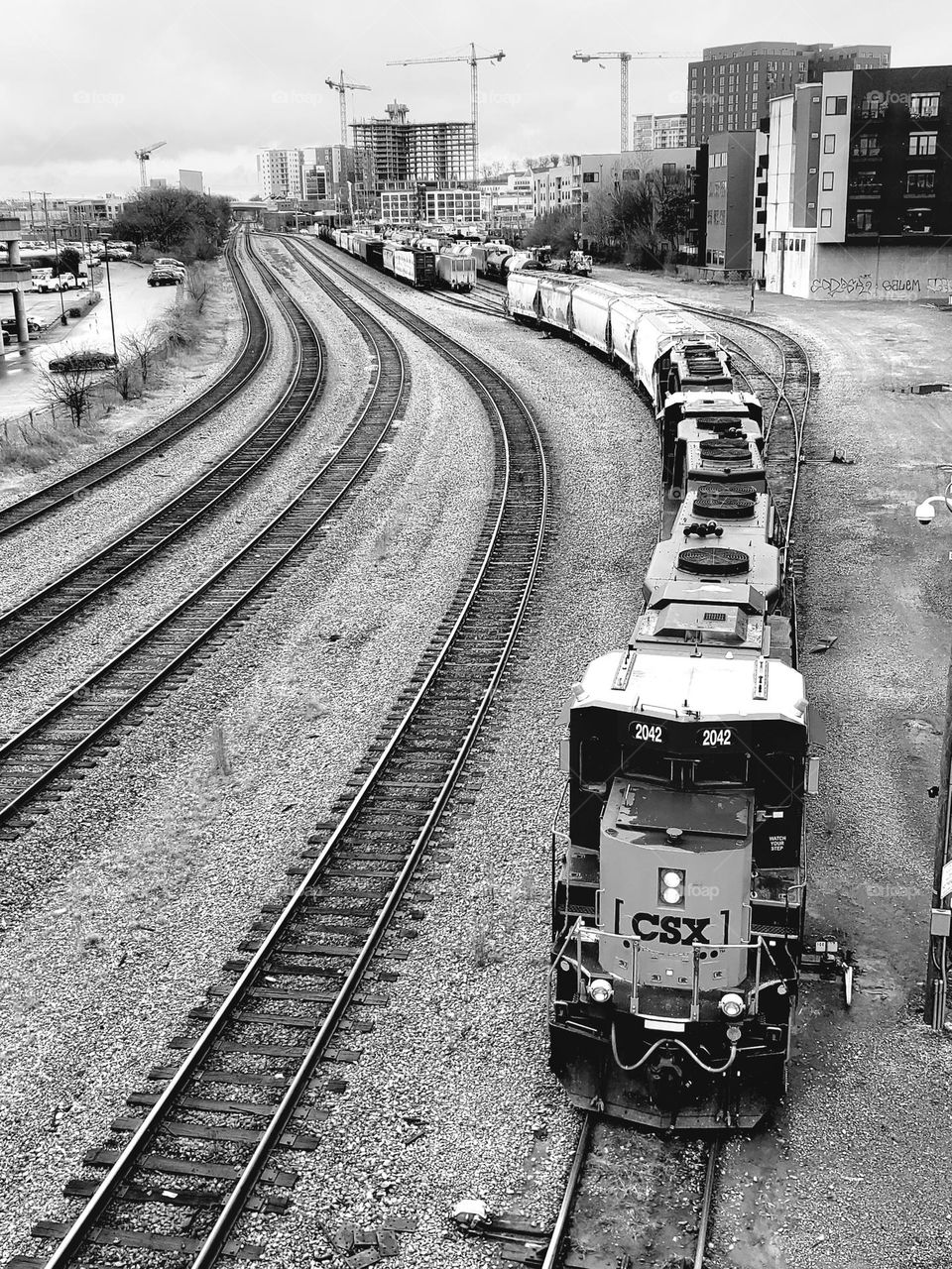 A train powers through a rail yard in Nashville