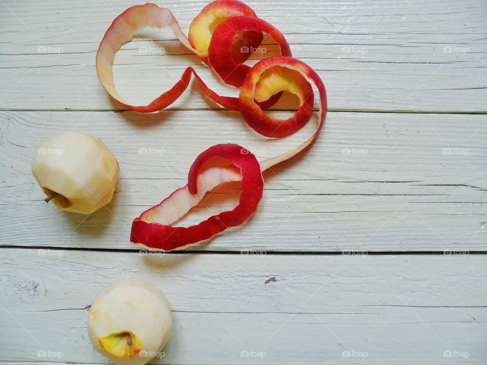 Peeled apples on the white boards