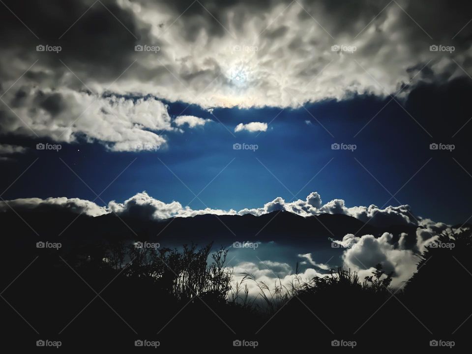 Moon light spreading on the mountains 