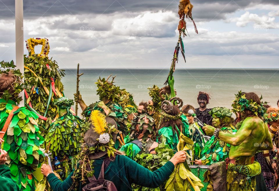 Revellers enjoy the Hastings Traditional Jack in the Green festivities, high on the hill above the sea - U.K. 2008