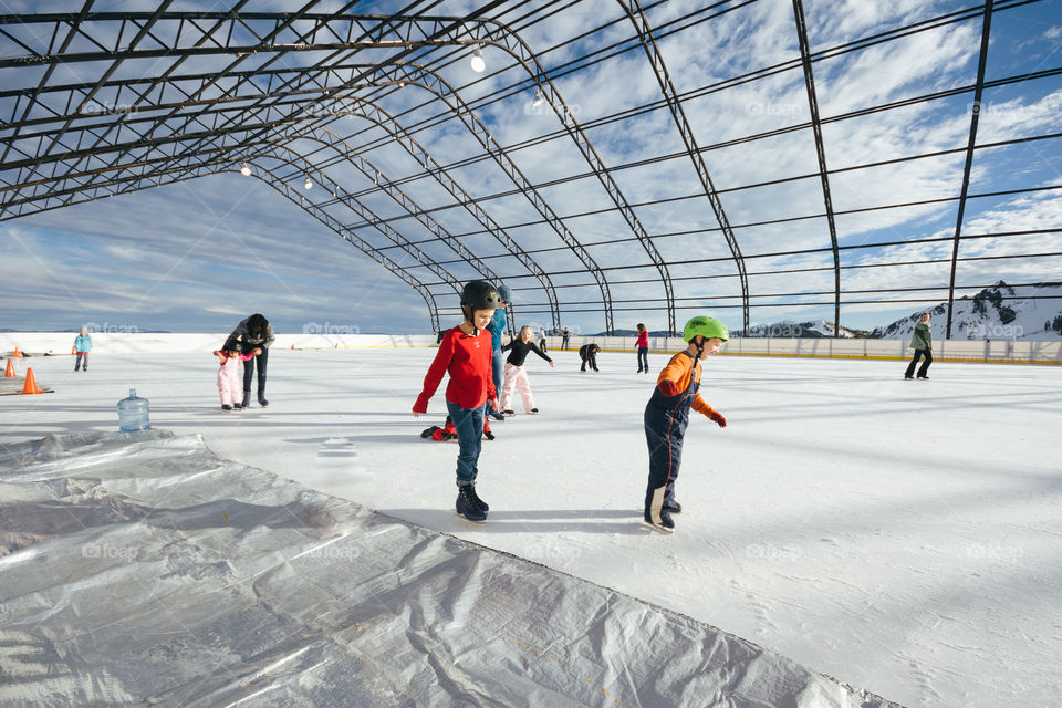 Kids skating on the ice rink