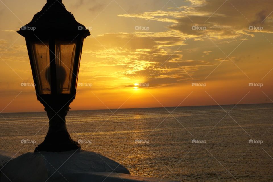 Sunrise#lamp#sea#clouds#sky