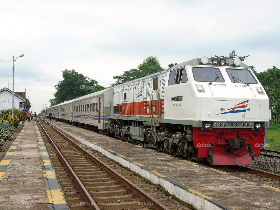 Waiting for you here until you comeback to me

In frame : Penataran Local Train with GE U20 Widecab version (CC 203) stops in Sukorejo Railway Station, Pasuruan Regency, East Java (Because Pasuruan has 2 areas, Pasuruan City & Pasuruan Regency)