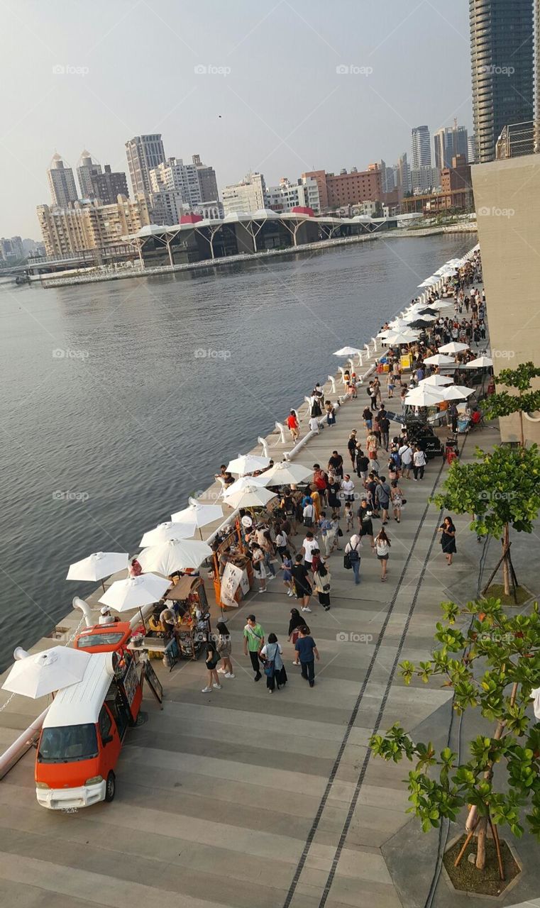 Many tourists are visiting the market in Kaohsiung Music Center